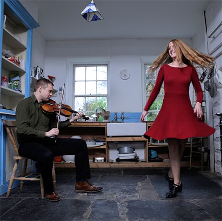 Ciarán Ó Maonaigh & Caitlín Nic Gabhann. Ciaran is playing the fiddle and Caitlín is dancing