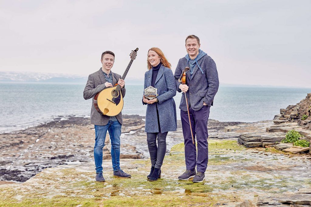 The trio is made up of acclaimed musicians Caitlín Nic Gabhann (concertina, dance), Ciarán Ó Maonaigh (fiddles) and Cathal Ó Curráin (vocals, bouzouki, fiddle)
